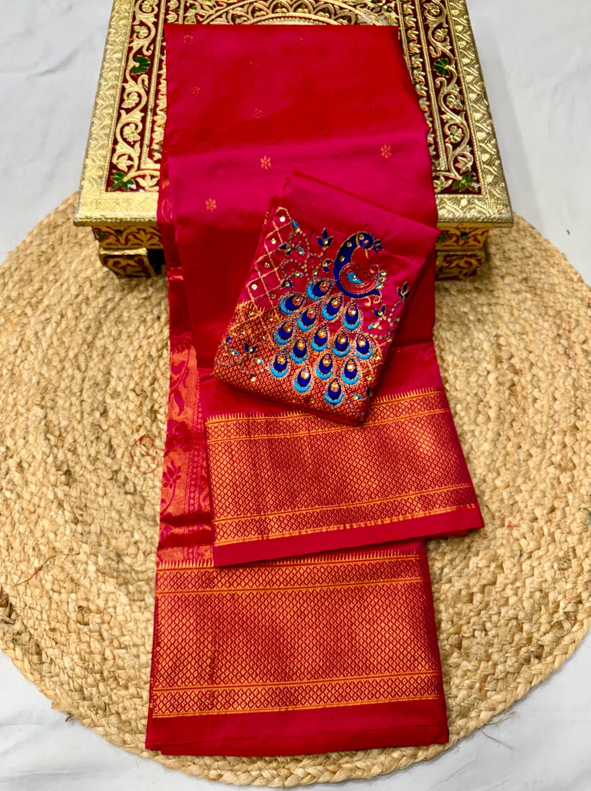 Elevate your festive and wedding wardrobe with the Trisha Kalanjali Paithani Saree, featuring elegant all-over butti weaving, a rich traditional pallu, and a beautifully detailed blouse with Aari work and Diamond Swarovski-style embellishments. Crafted from premium Tana soft silk for a graceful and comfortable drape