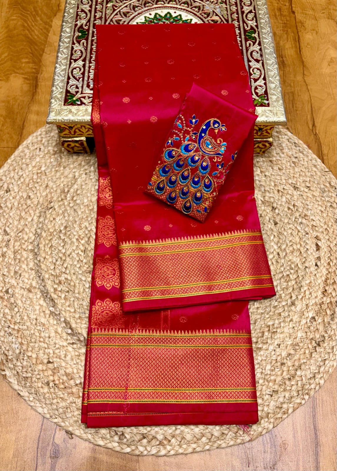 Elevate your festive and wedding wardrobe with the Trisha Kalanjali Paithani Saree, featuring elegant all-over butti weaving, a rich traditional pallu, and a beautifully detailed blouse with Aari work and Diamond Swarovski-style embellishments. Crafted from premium Tana soft silk for a graceful and comfortable drape