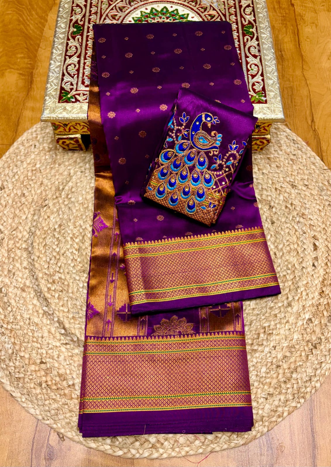 Elevate your festive and wedding wardrobe with the Trisha Kalanjali Paithani Saree, featuring elegant all-over butti weaving, a rich traditional pallu, and a beautifully detailed blouse with Aari work and Diamond Swarovski-style embellishments. Crafted from premium Tana soft silk for a graceful and comfortable drape