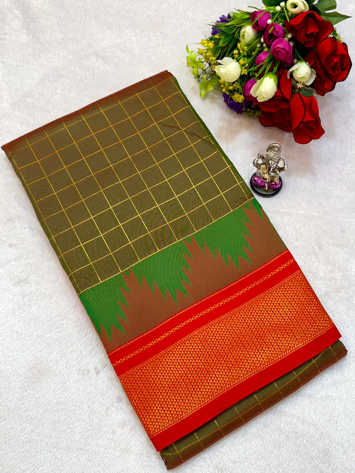 New Design Launching Shop the elegant Neha Checks Irkal Paithani Saree, crafted from premium Katan silk that feels like pure silk. Designed with all-over classic checks and paired with an exclusive contrast blouse, this saree is perfect for festive wear, weddings, and special occasions. Experience tradition with a modern touch.