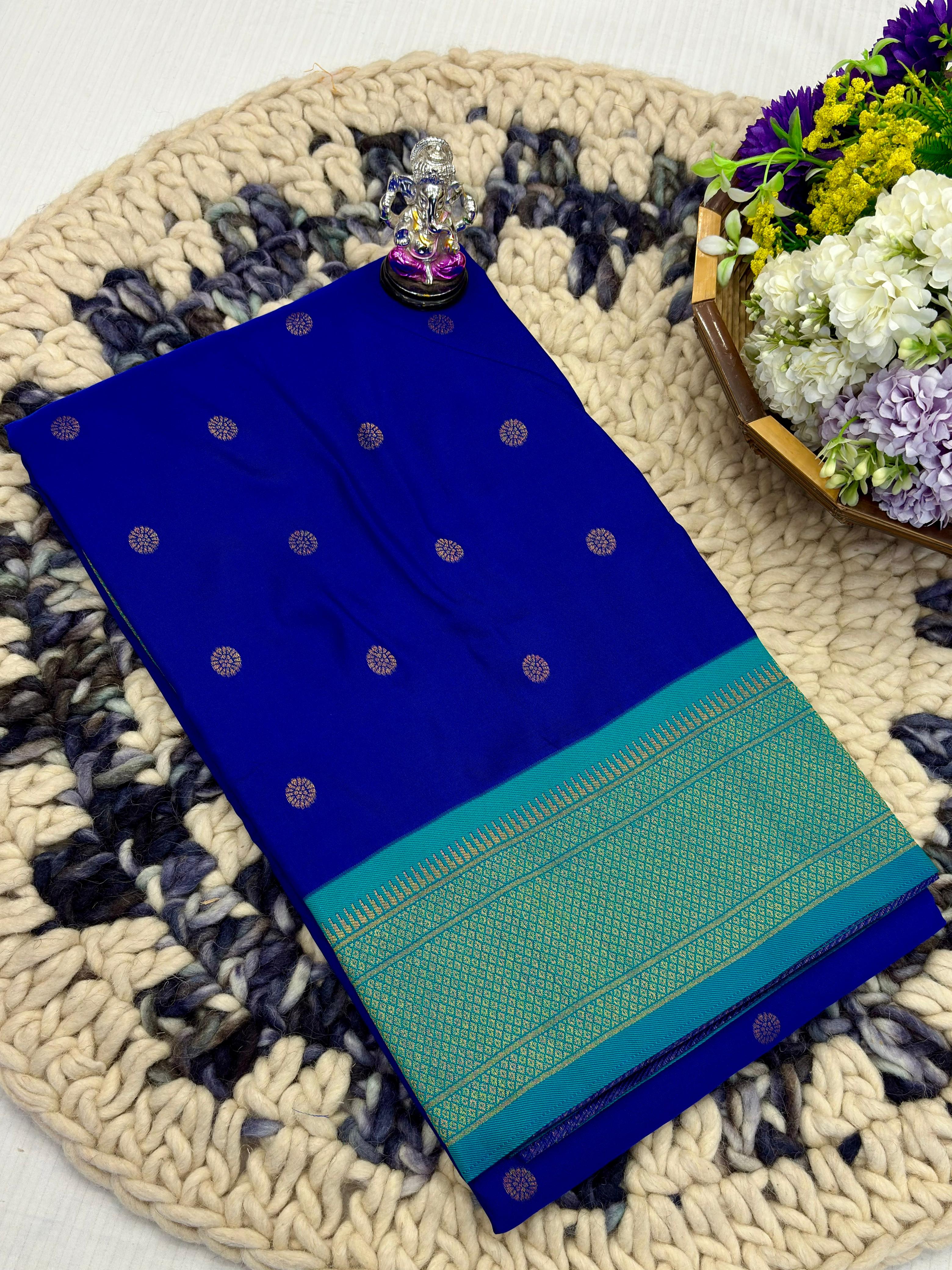 Shop Shloka Kalanjali Paithani Saree in Katan Silk with all-over zari butti, dual side border, and blouse piece. Perfect for weddings &amp; festive wear.