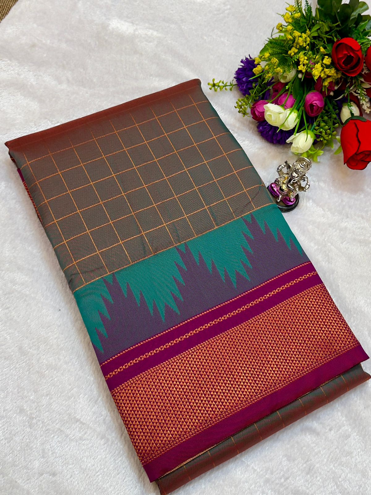 New Design Launching Shop the elegant Neha Checks Irkal Paithani Saree, crafted from premium Katan silk that feels like pure silk. Designed with all-over classic checks and paired with an exclusive contrast blouse, this saree is perfect for festive wear, weddings, and special occasions. Experience tradition with a modern touch.