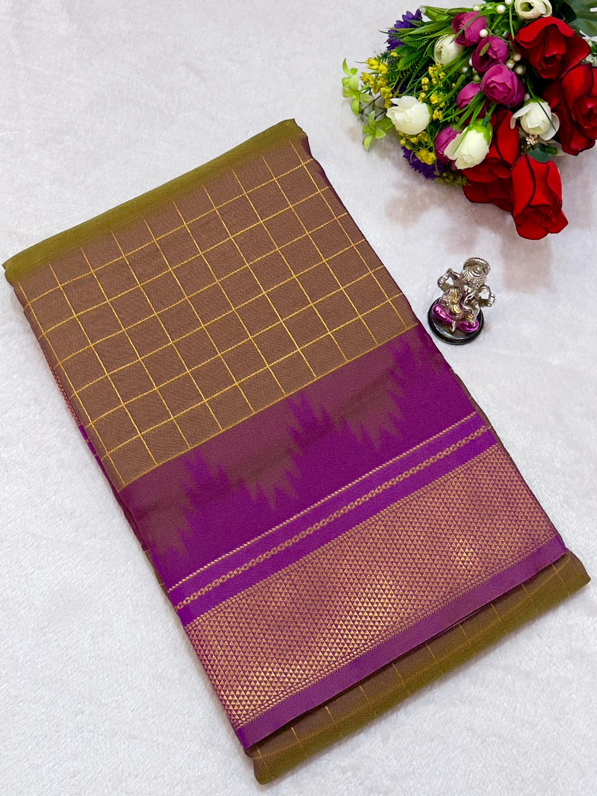 New Design Launching Shop the elegant Neha Checks Irkal Paithani Saree, crafted from premium Katan silk that feels like pure silk. Designed with all-over classic checks and paired with an exclusive contrast blouse, this saree is perfect for festive wear, weddings, and special occasions. Experience tradition with a modern touch.