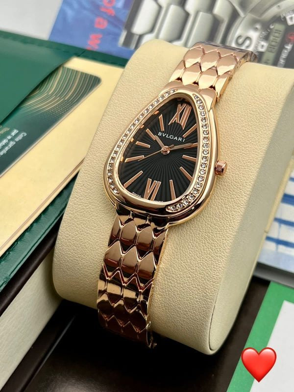 Bvlgari Branded Analog Watch With Rose Gold Colr Metal Case & Strap Watch With Black Dial

Dial: Black Dial gives elegant looks  
Strap: Rose Gold Strap in metal present longuity
Watch : For Girl Or Woman
Usage: Best Gift for leved once
