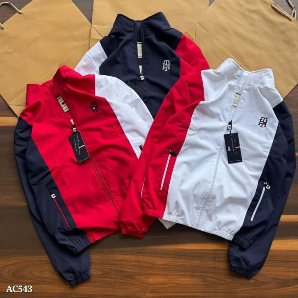 stylish embroidery detailing and both-side zip pockets, this windcheater offers a perfect blend of functionality and premium design. The soft net lining inside enhances comfort, making it ideal for daily wear, travel, or outdoor activities.