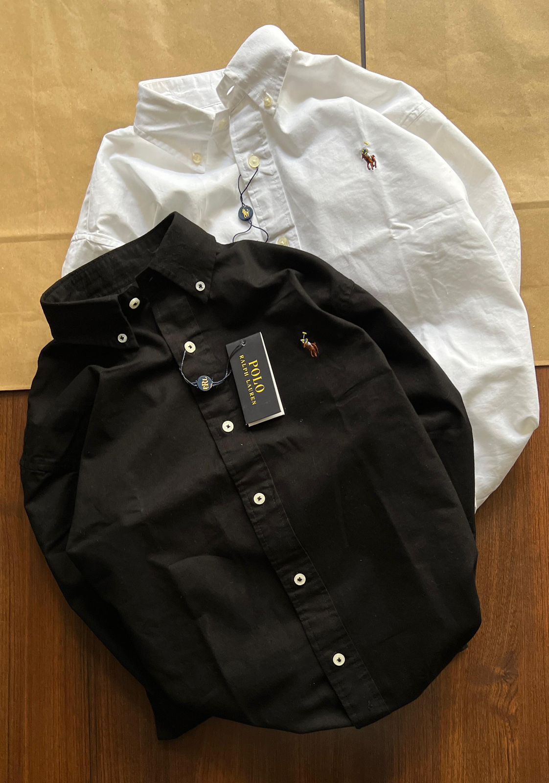 Shop Ralph Lauren RFD Cotton Plain Shirts in premium OG quality. Classic plain style with embroidered logo. Available in Black &amp; White, sizes S-XL. Perfect for premium fashion lovers.