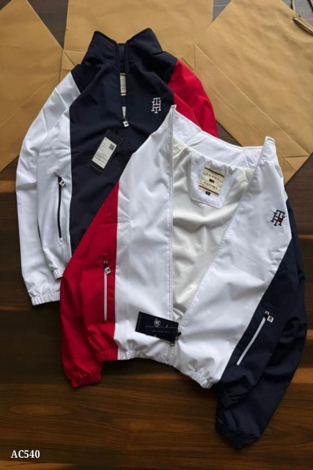 stylish embroidery detailing and both-side zip pockets, this windcheater offers a perfect blend of functionality and premium design. The soft net lining inside enhances comfort, making it ideal for daily wear, travel, or outdoor activities.