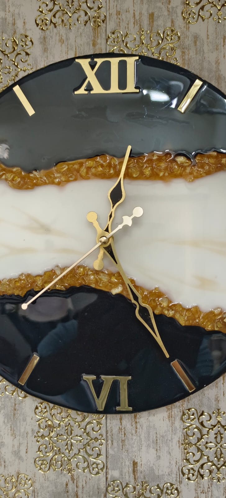 Add a touch of luxury and artistic elegance to your space with the NAVYA Handmade Resin Wall Clock. Expertly crafted using premium-quality resin, this designer clock showcases a mesmerizing marble and agate-inspired pattern with flowing teal, white, and subtle gold accents—making every piece truly one of a kind.