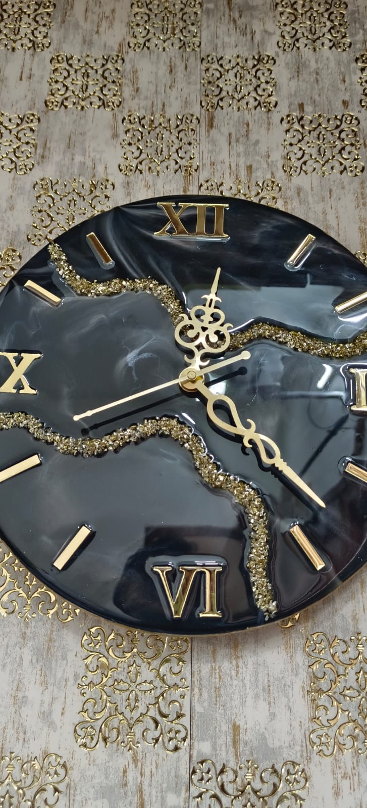 Add a touch of luxury and artistic elegance to your space with the NAVYA Handmade Resin Wall Clock. Expertly crafted using premium-quality resin, this designer clock showcases a mesmerizing marble and agate-inspired pattern with flowing teal, white, and subtle gold accents—making every piece truly one of a kind.