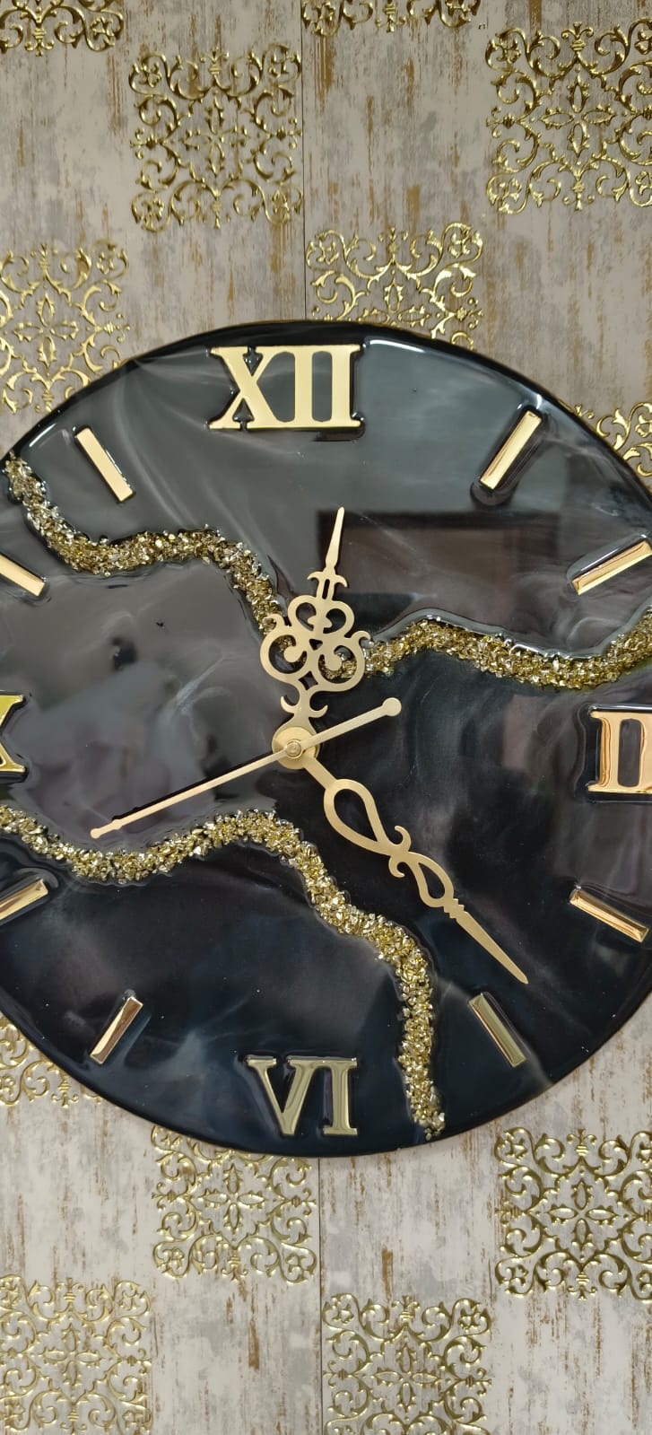 Add a touch of luxury and artistic elegance to your space with the NAVYA Handmade Resin Wall Clock. Expertly crafted using premium-quality resin, this designer clock showcases a mesmerizing marble and agate-inspired pattern with flowing teal, white, and subtle gold accents—making every piece truly one of a kind.