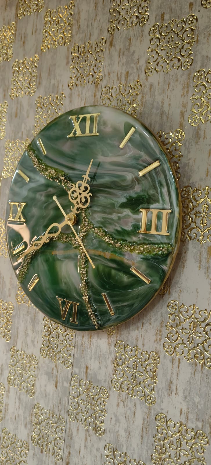 Add a touch of luxury and artistic elegance to your space with the NAVYA Handmade Resin Wall Clock. Expertly crafted using premium-quality resin, this designer clock showcases a mesmerizing marble and agate-inspired pattern with flowing teal, white, and subtle gold accents—making every piece truly one of a kind.