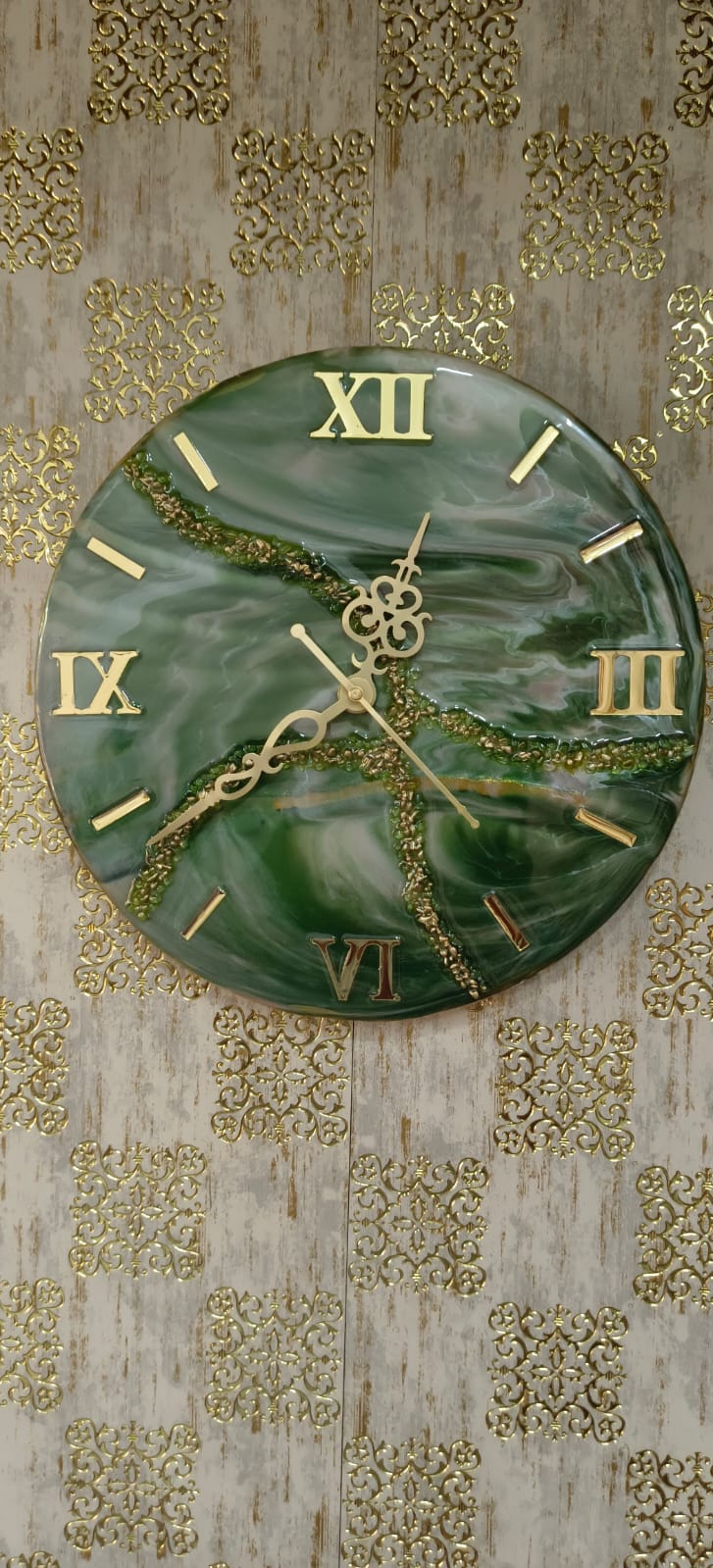 Add a touch of luxury and artistic elegance to your space with the NAVYA Handmade Resin Wall Clock. Expertly crafted using premium-quality resin, this designer clock showcases a mesmerizing marble and agate-inspired pattern with flowing teal, white, and subtle gold accents—making every piece truly one of a kind.