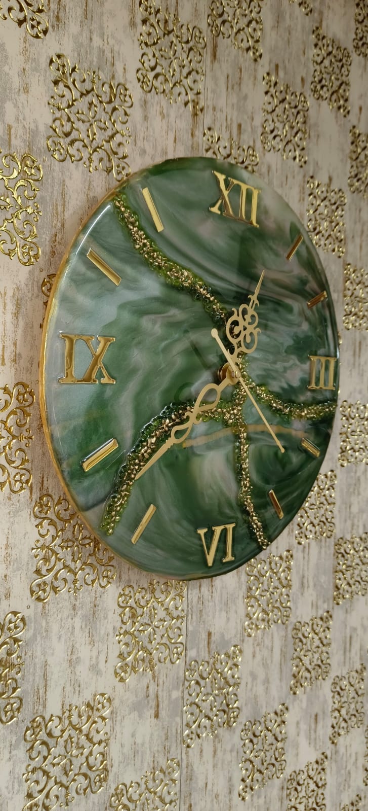 Add a touch of luxury and artistic elegance to your space with the NAVYA Handmade Resin Wall Clock. Expertly crafted using premium-quality resin, this designer clock showcases a mesmerizing marble and agate-inspired pattern with flowing teal, white, and subtle gold accents—making every piece truly one of a kind.