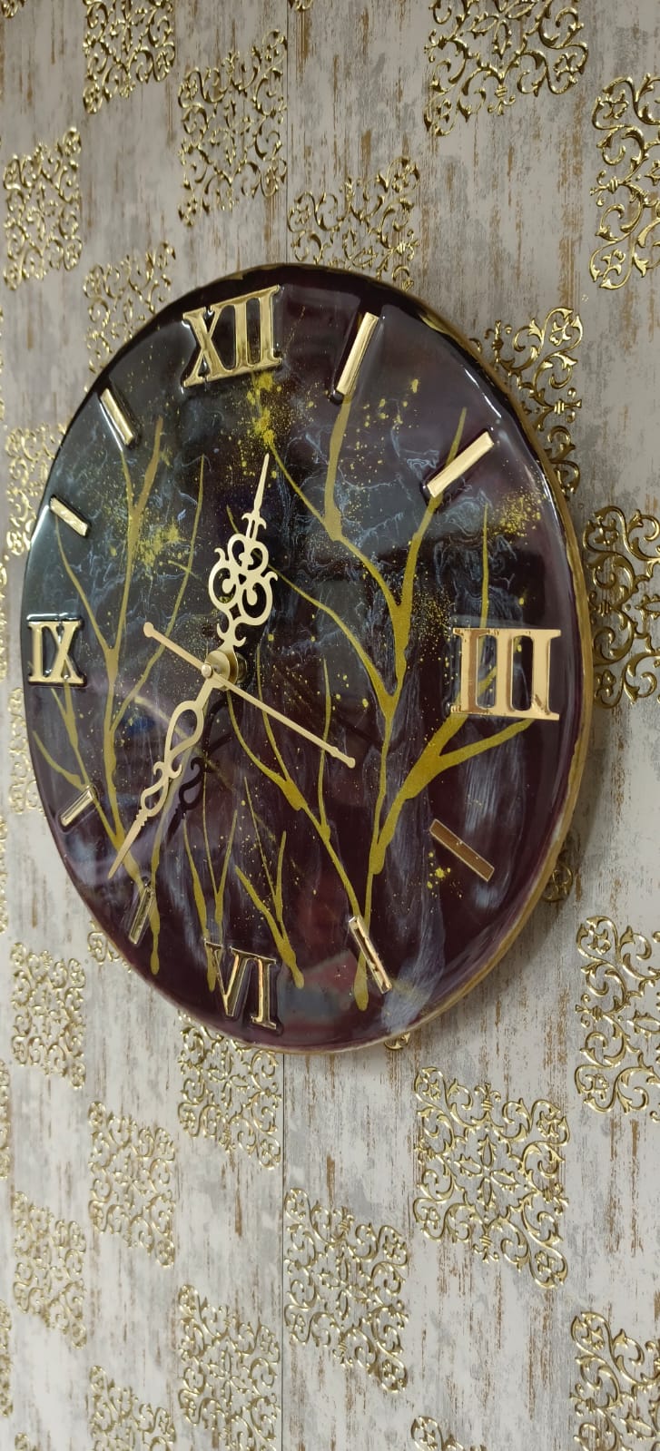 Add a touch of luxury and artistic elegance to your space with the NAVYA Handmade Resin Wall Clock. Expertly crafted using premium-quality resin, this designer clock showcases a mesmerizing marble and agate-inspired pattern with flowing teal, white, and subtle gold accents—making every piece truly one of a kind.