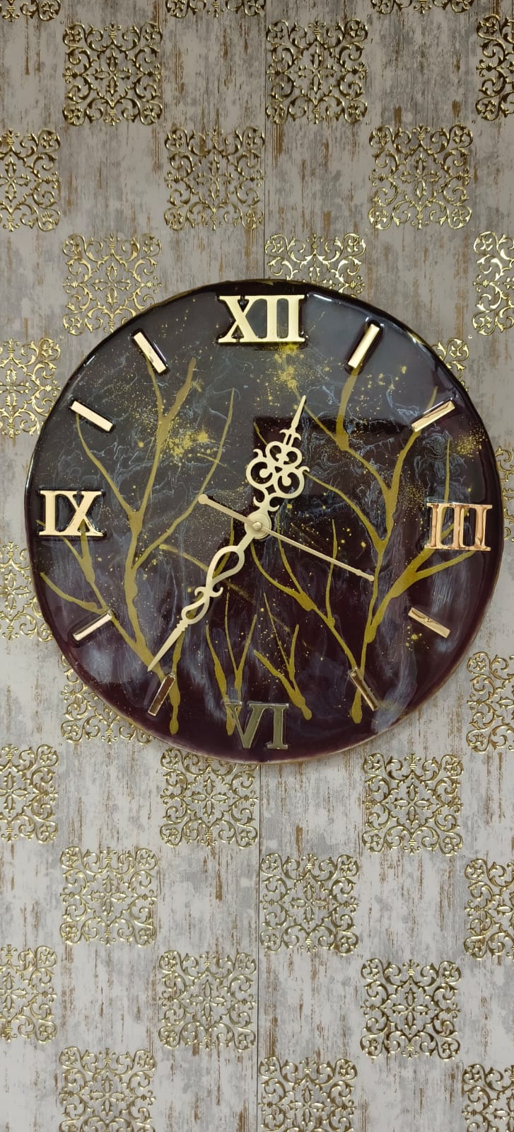 Add a touch of luxury and artistic elegance to your space with the NAVYA Handmade Resin Wall Clock. Expertly crafted using premium-quality resin, this designer clock showcases a mesmerizing marble and agate-inspired pattern with flowing teal, white, and subtle gold accents—making every piece truly one of a kind.