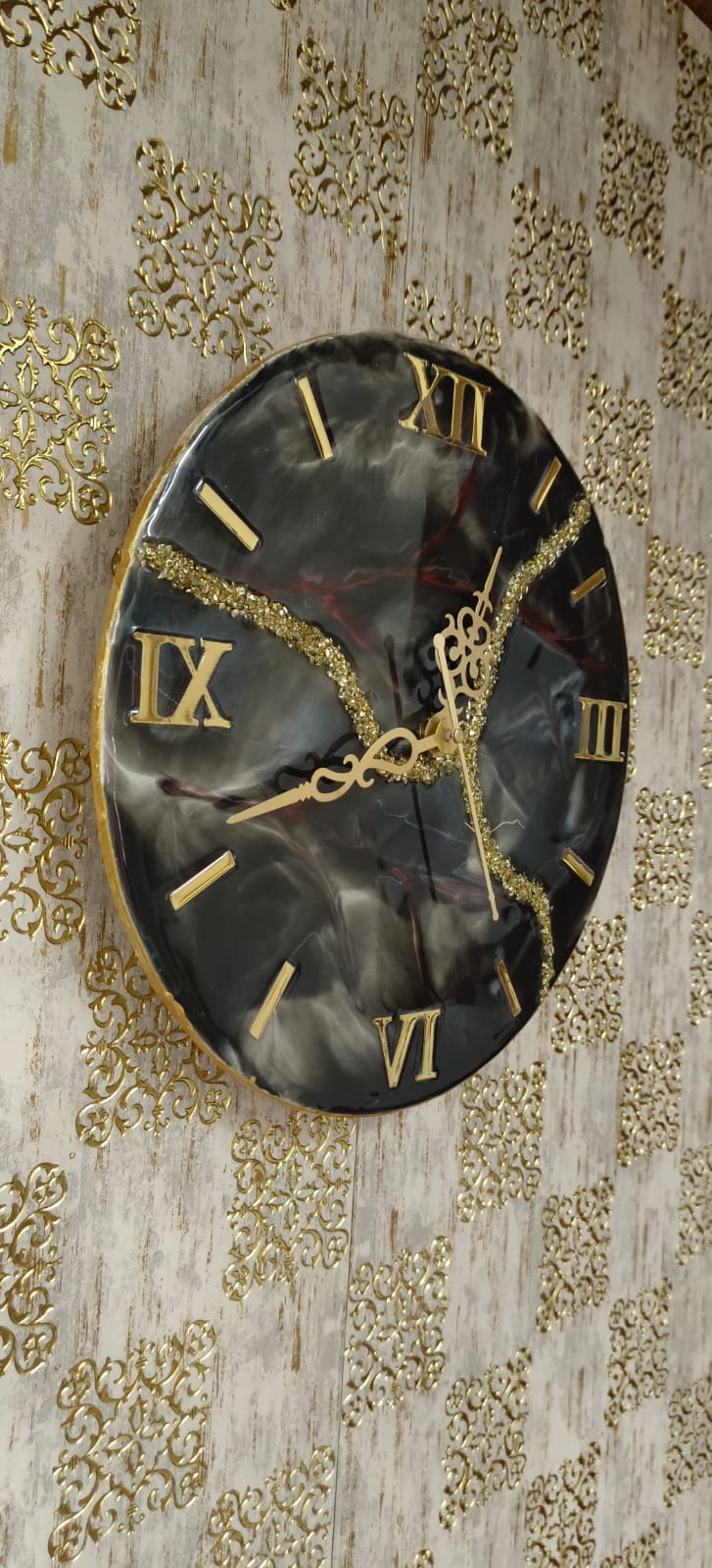 Add a touch of luxury and artistic elegance to your space with the NAVYA Handmade Resin Wall Clock. Expertly crafted using premium-quality resin, this designer clock showcases a mesmerizing marble and agate-inspired pattern with flowing teal, white, and subtle gold accents—making every piece truly one of a kind.