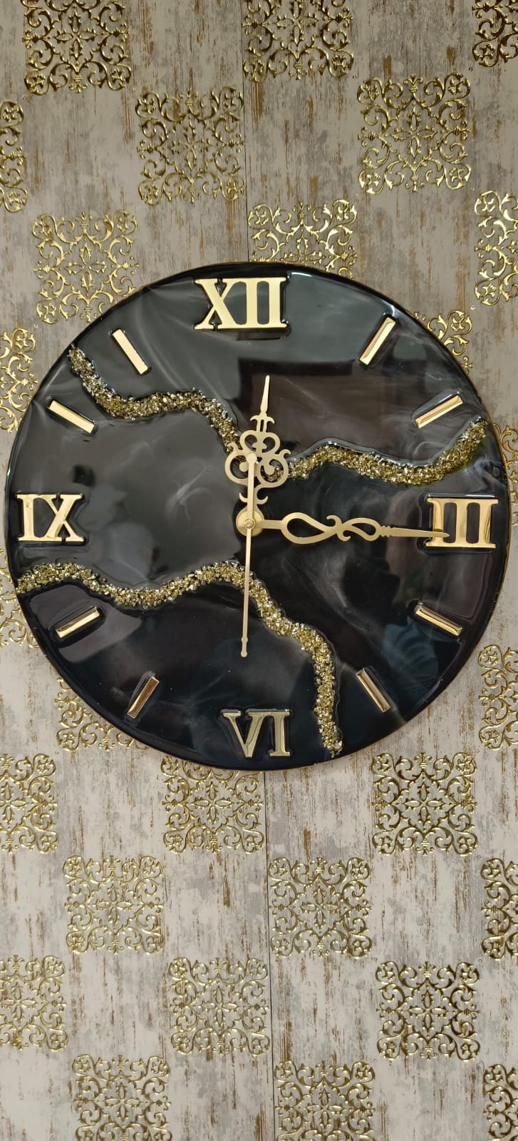 Add a touch of luxury and artistic elegance to your space with the NAVYA Handmade Resin Wall Clock. Expertly crafted using premium-quality resin, this designer clock showcases a mesmerizing marble and agate-inspired pattern with flowing teal, white, and subtle gold accents—making every piece truly one of a kind.