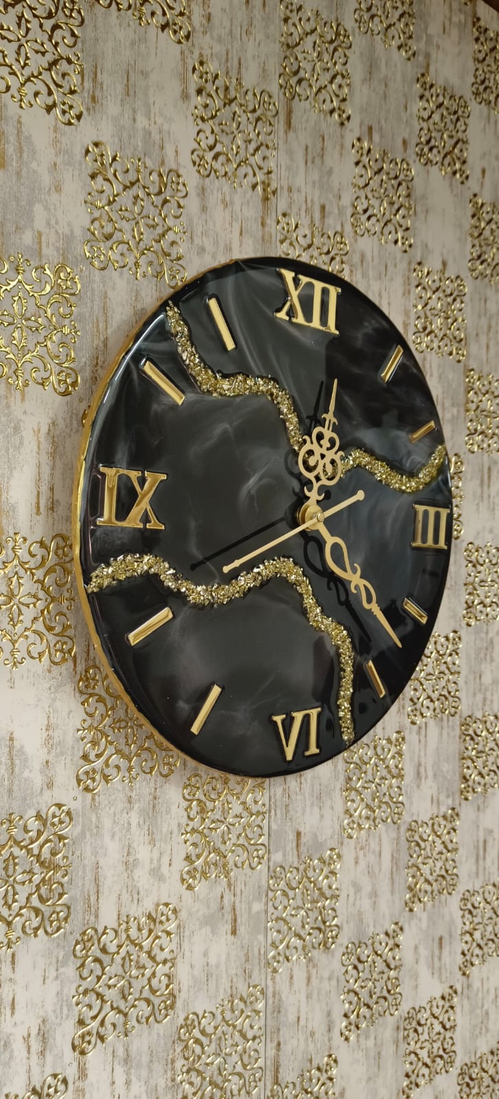 Add a touch of luxury and artistic elegance to your space with the NAVYA Handmade Resin Wall Clock. Expertly crafted using premium-quality resin, this designer clock showcases a mesmerizing marble and agate-inspired pattern with flowing teal, white, and subtle gold accents—making every piece truly one of a kind.