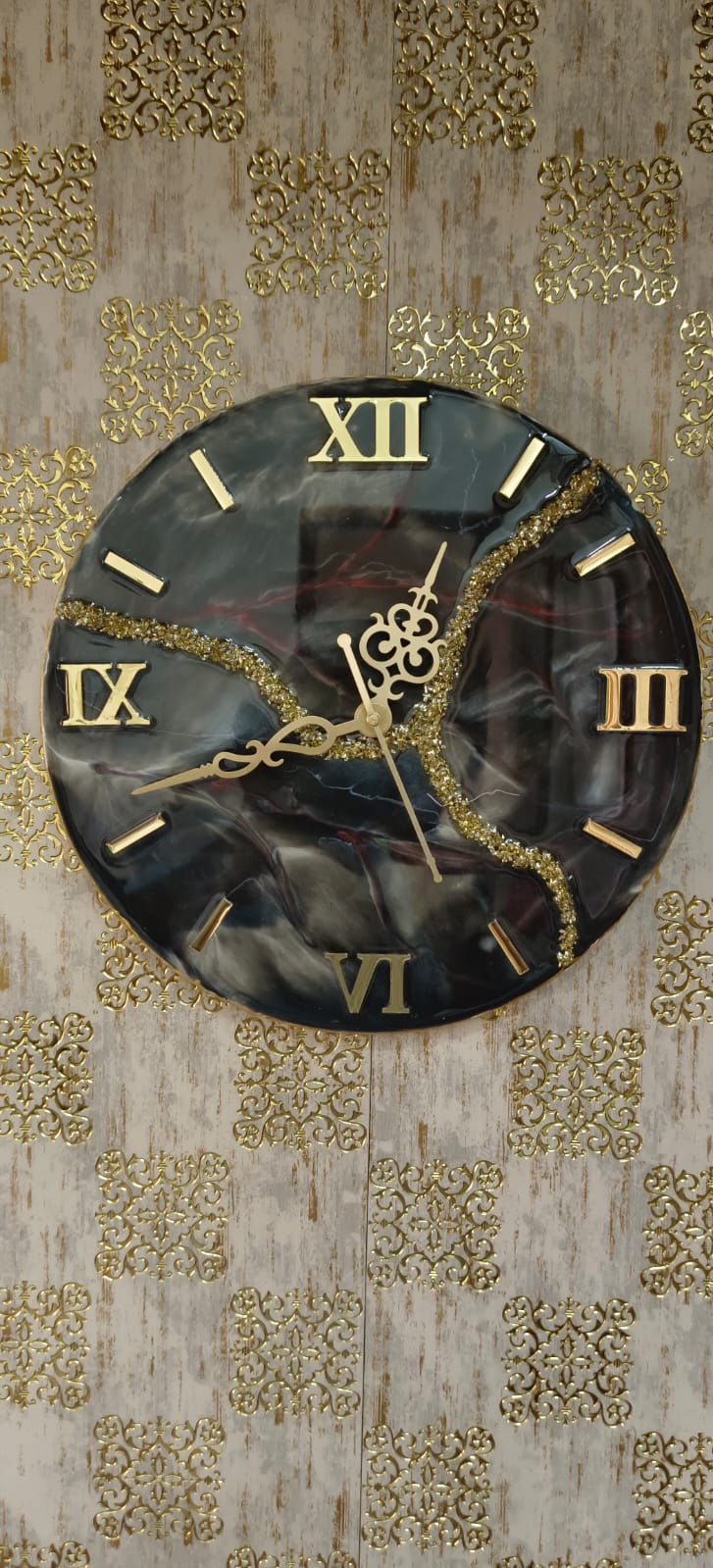 Add a touch of luxury and artistic elegance to your space with the NAVYA Handmade Resin Wall Clock. Expertly crafted using premium-quality resin, this designer clock showcases a mesmerizing marble and agate-inspired pattern with flowing teal, white, and subtle gold accents—making every piece truly one of a kind.