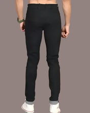 Load image into Gallery viewer, Flying Plain Mid Rise BLACK Jeans for Men

Sizes: 28, 30,32

Color: Black
Fabric: Denim
Type: Mid-Rise Jeans
Style: Solid
Design Type: Slim Fit
Waist Closure: Button

These stylish-fancy black denim solid mid-rise jeans are the perfect addition to any fashion-forward man&#39;s wardrobe. Made with high-quality denim, these jeans offer both comfort and style. With a classic mid-rise fit, they are versatile and can be dressed up or down for any occasion. Perfect for the modern man on-the-go.