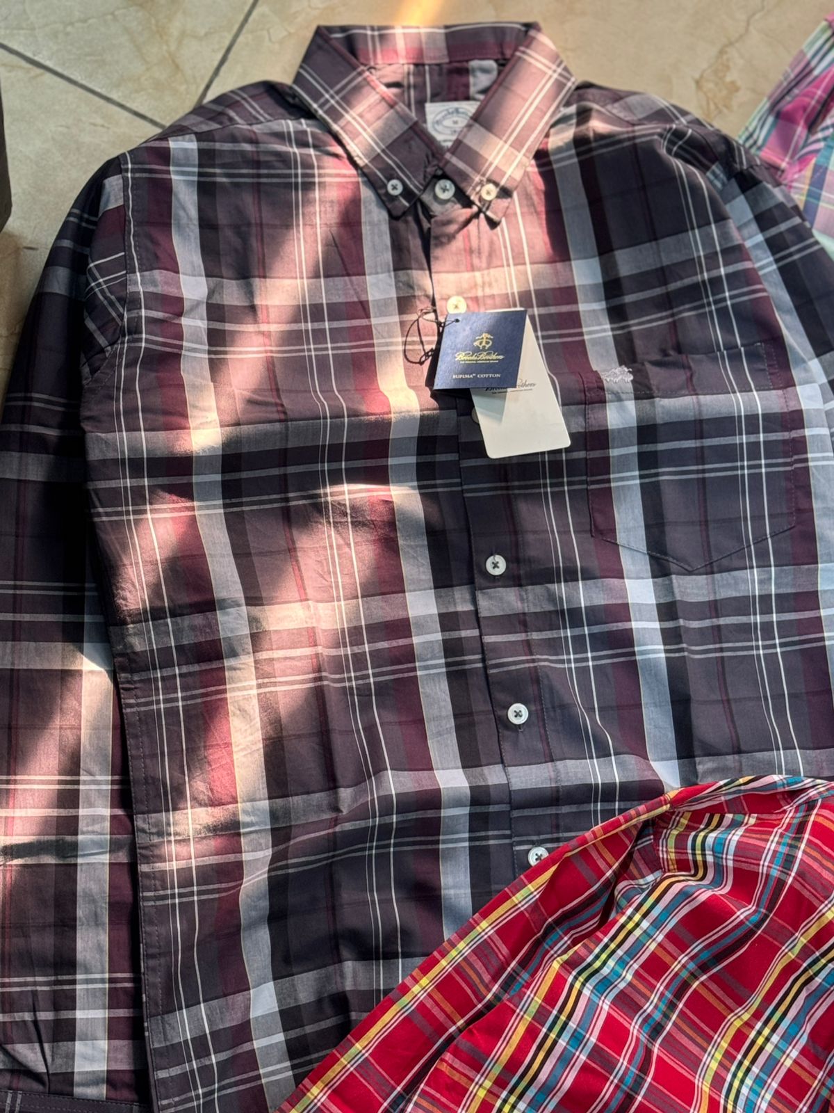 Upgrade your wardrobe with the Brook Brother Premium Cotton Check Shirt, crafted from 100% pure cotton for ultimate comfort and breathabilit