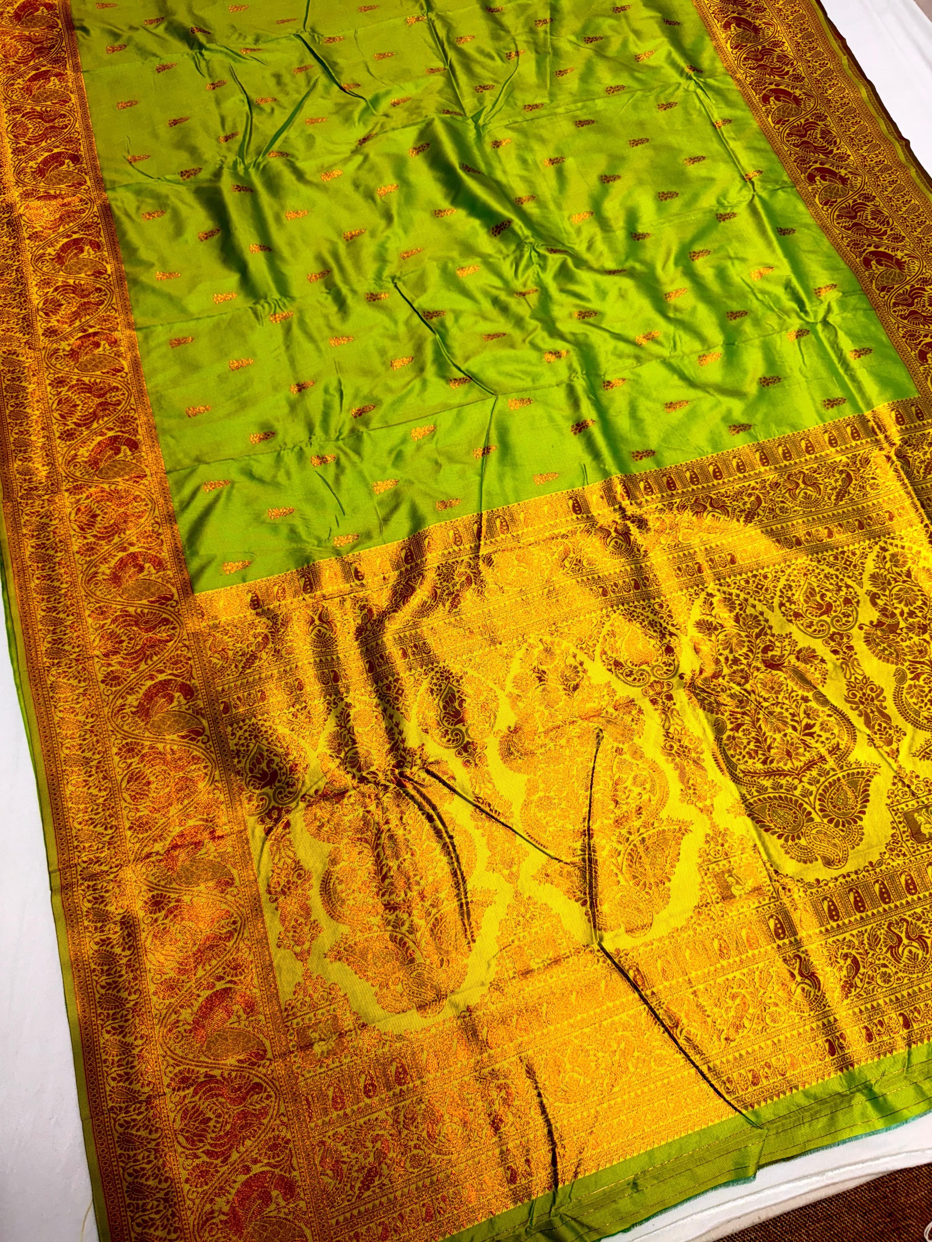 Elevate your ethnic wardrobe with this Mahalaxmi Kanjivaram Paithani Saree, crafted from Pure Soft Silk with rich all-over buttis, a grand pallu, and matching running blouse piece — perfect for festivals and weddings.