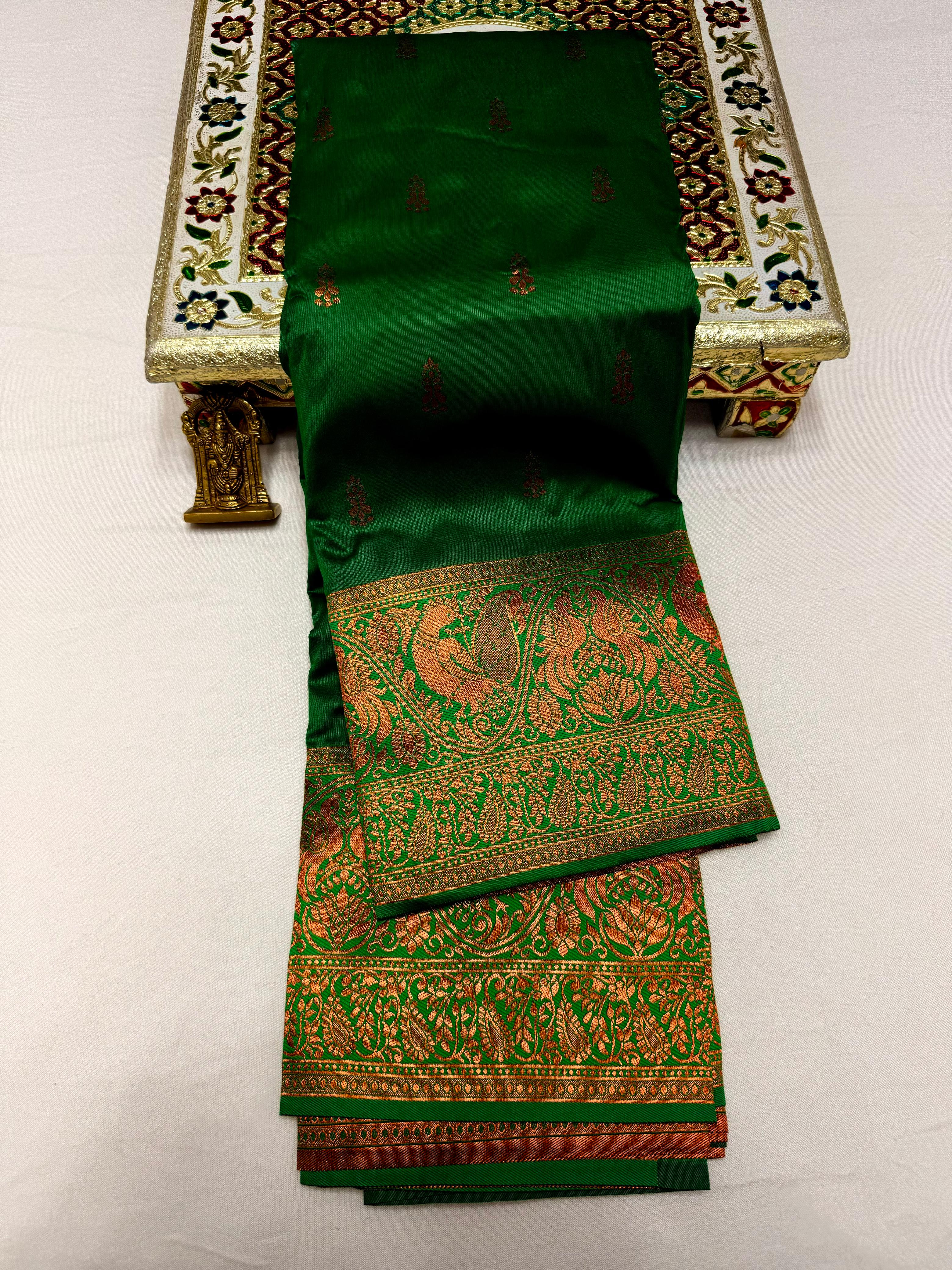 Elevate your ethnic wardrobe with this Mahalaxmi Kanjivaram Paithani Saree, crafted from Pure Soft Silk with rich all-over buttis, a grand pallu, and matching running blouse piece — perfect for festivals and weddings.