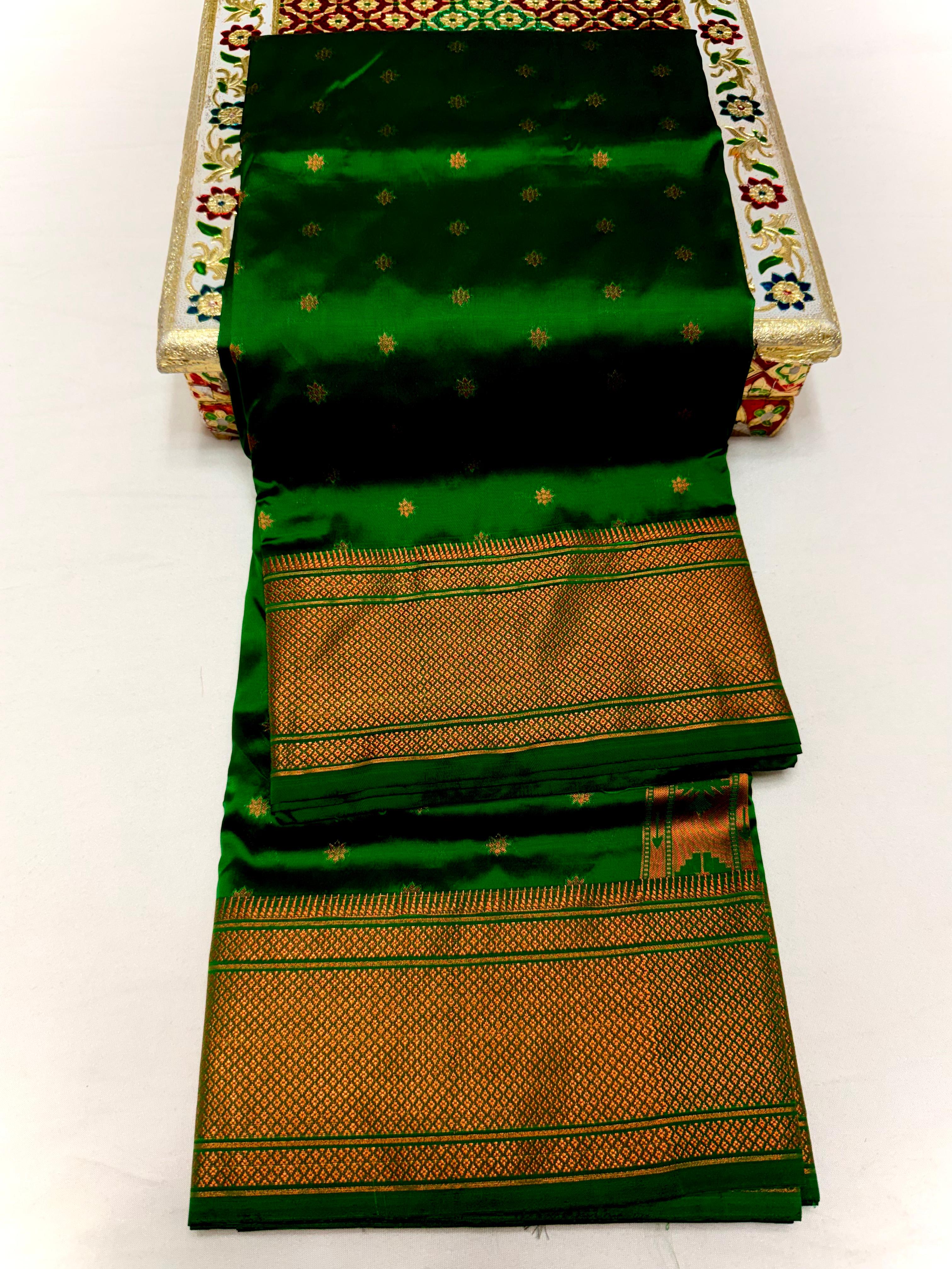 Traditional Tana Silk Kalanjali Paithani with rich Maharani pallu, crafted in premium pure soft silk. Featuring all-over Karnfuli butti, classic traditional border, and running blouse piece. A viral trending Paithani saree perfect for weddings, festivals, and special occasions.