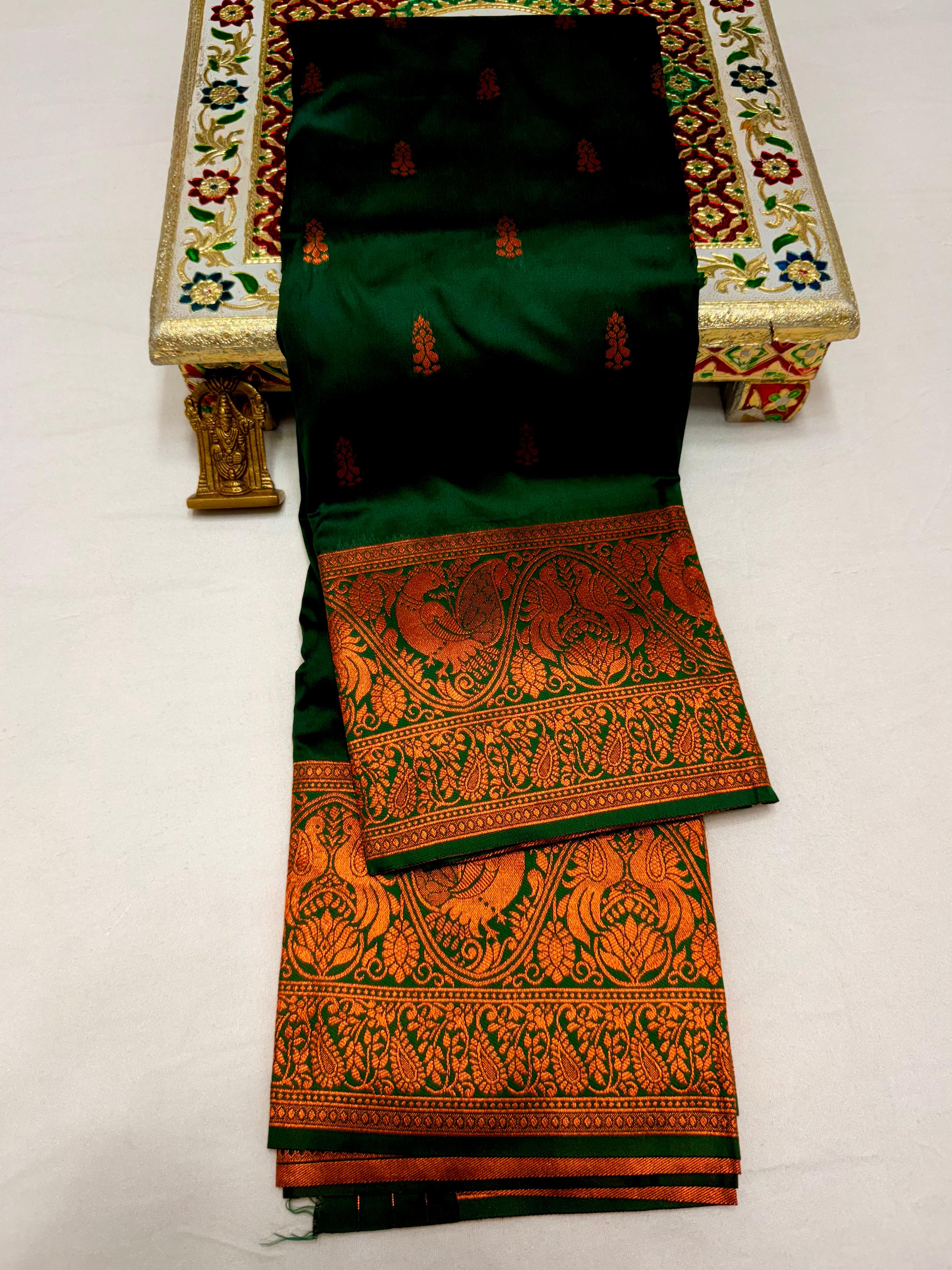 Elevate your ethnic wardrobe with this Mahalaxmi Kanjivaram Paithani Saree, crafted from Pure Soft Silk with rich all-over buttis, a grand pallu, and matching running blouse piece — perfect for festivals and weddings.