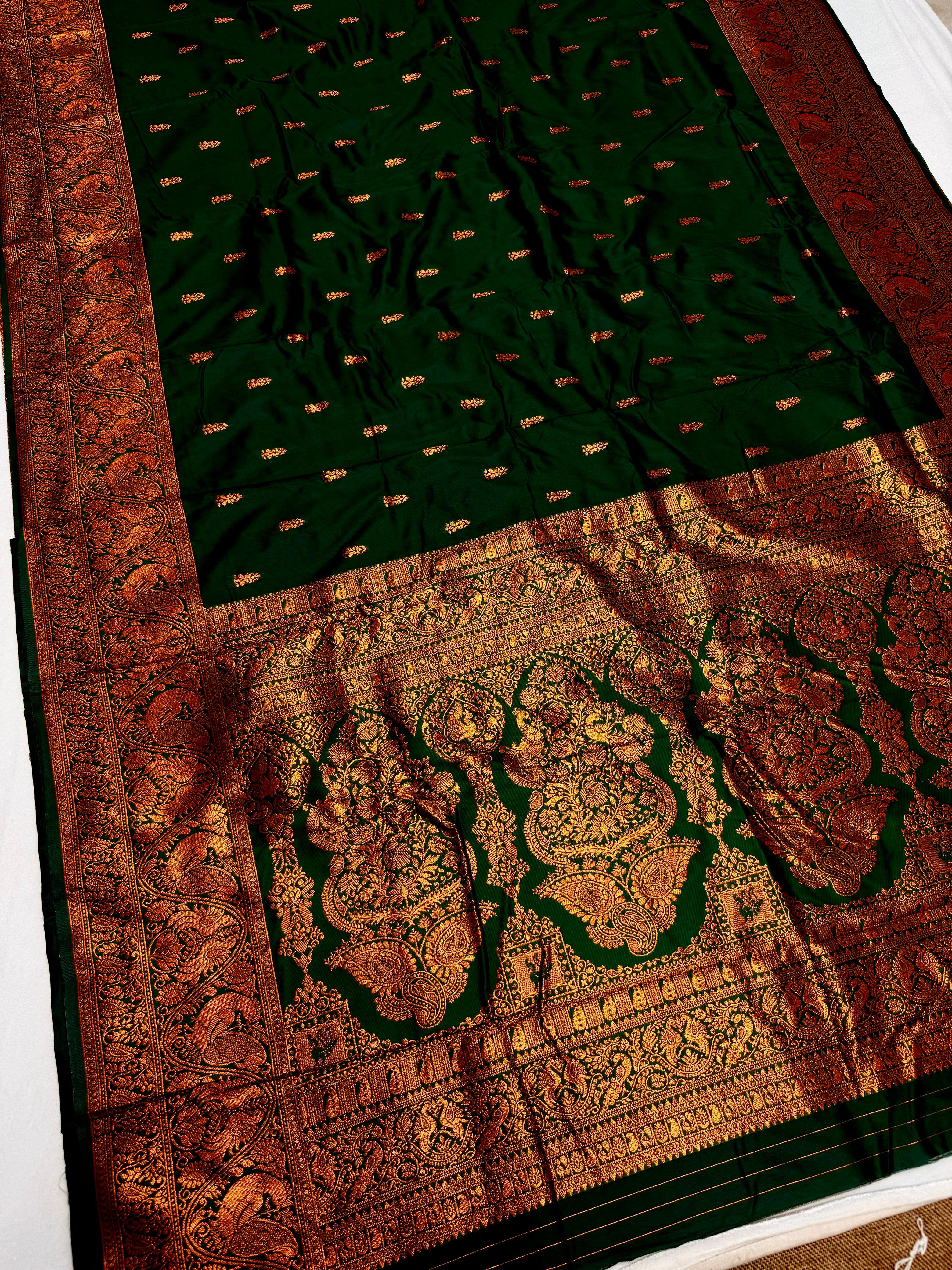 Elevate your ethnic wardrobe with this Mahalaxmi Kanjivaram Paithani Saree, crafted from Pure Soft Silk with rich all-over buttis, a grand pallu, and matching running blouse piece — perfect for festivals and weddings.