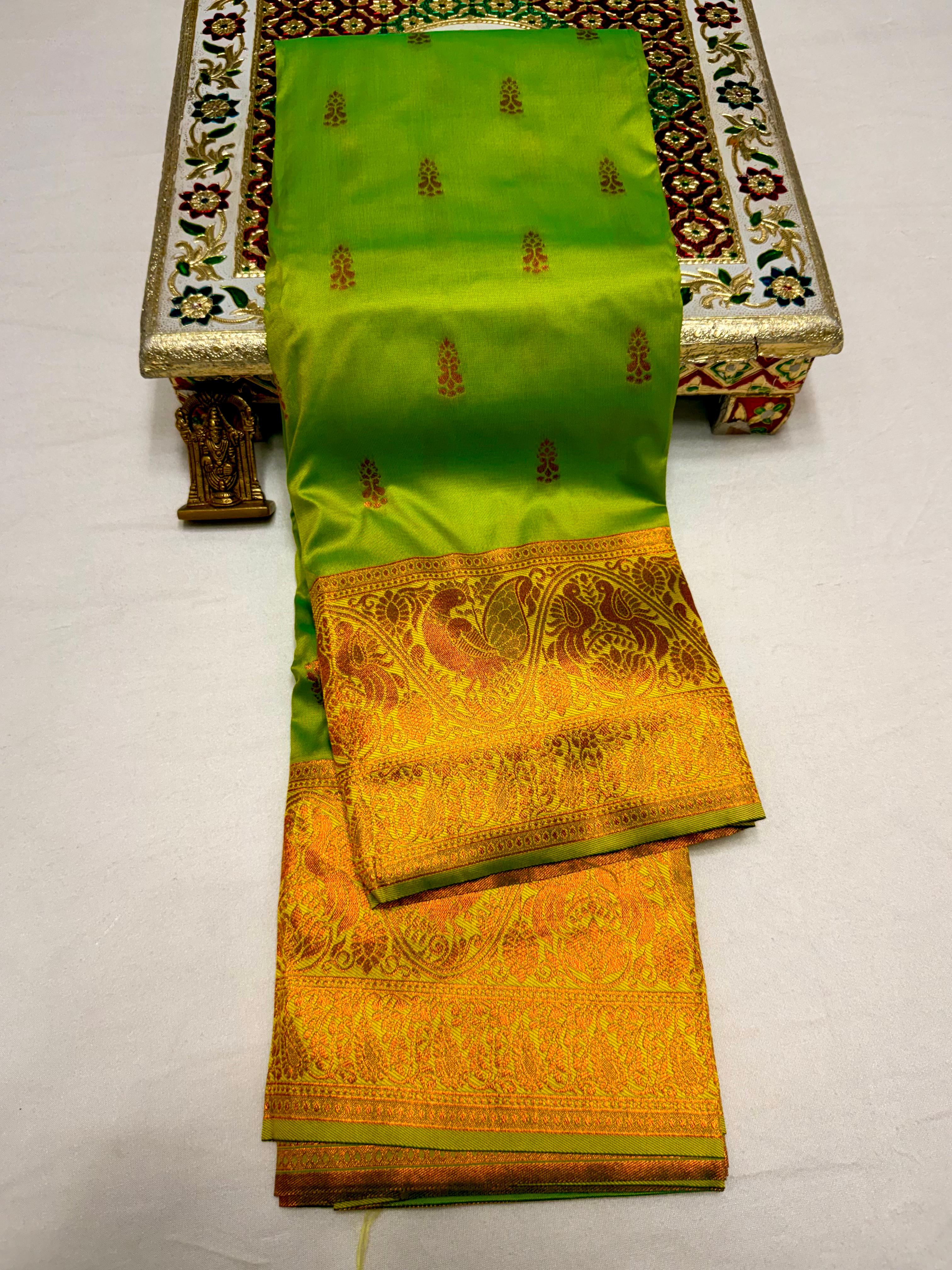 Elevate your ethnic wardrobe with this Mahalaxmi Kanjivaram Paithani Saree, crafted from Pure Soft Silk with rich all-over buttis, a grand pallu, and matching running blouse piece — perfect for festivals and weddings.