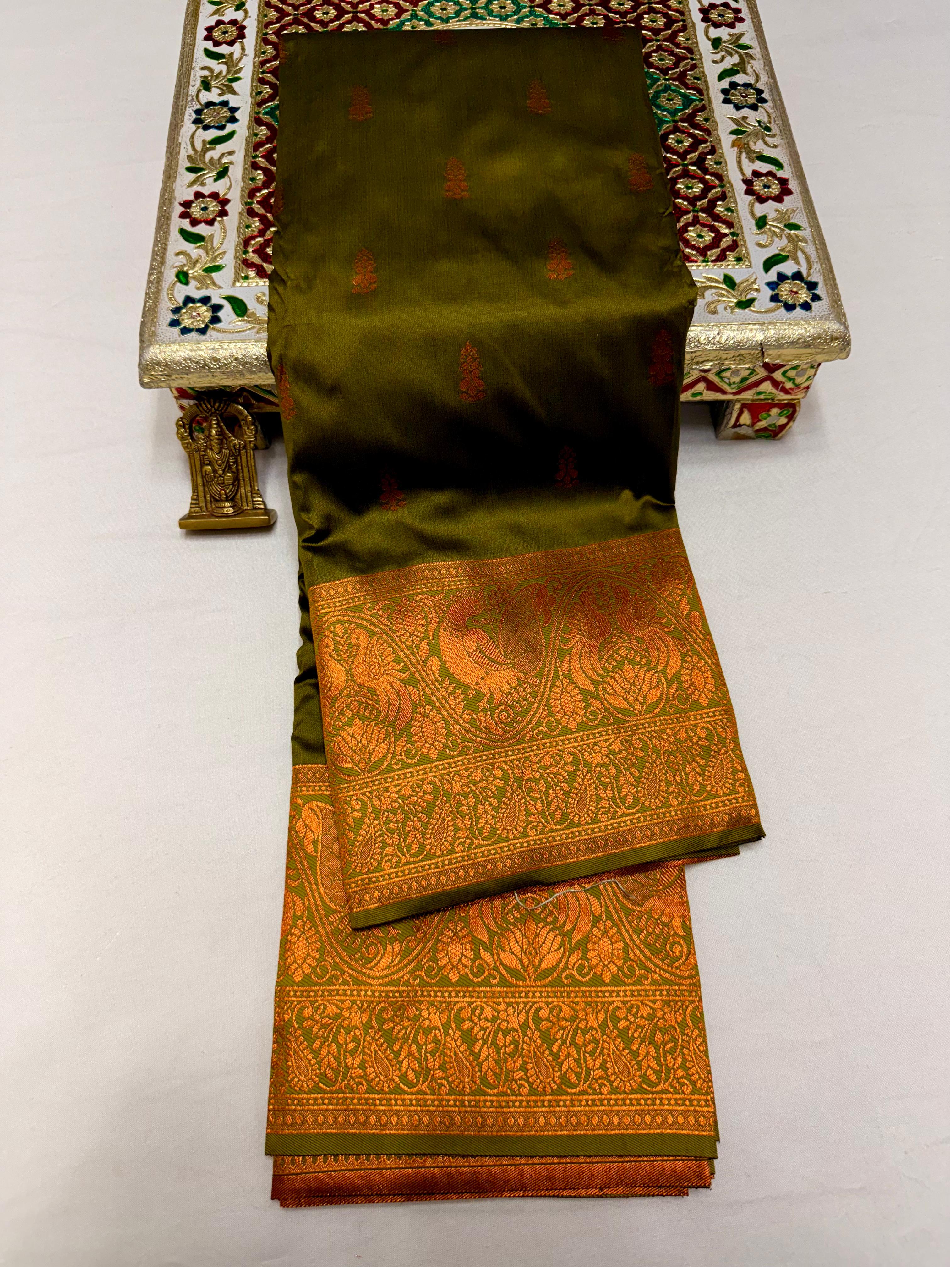 Elevate your ethnic wardrobe with this Mahalaxmi Kanjivaram Paithani Saree, crafted from Pure Soft Silk with rich all-over buttis, a grand pallu, and matching running blouse piece — perfect for festivals and weddings.