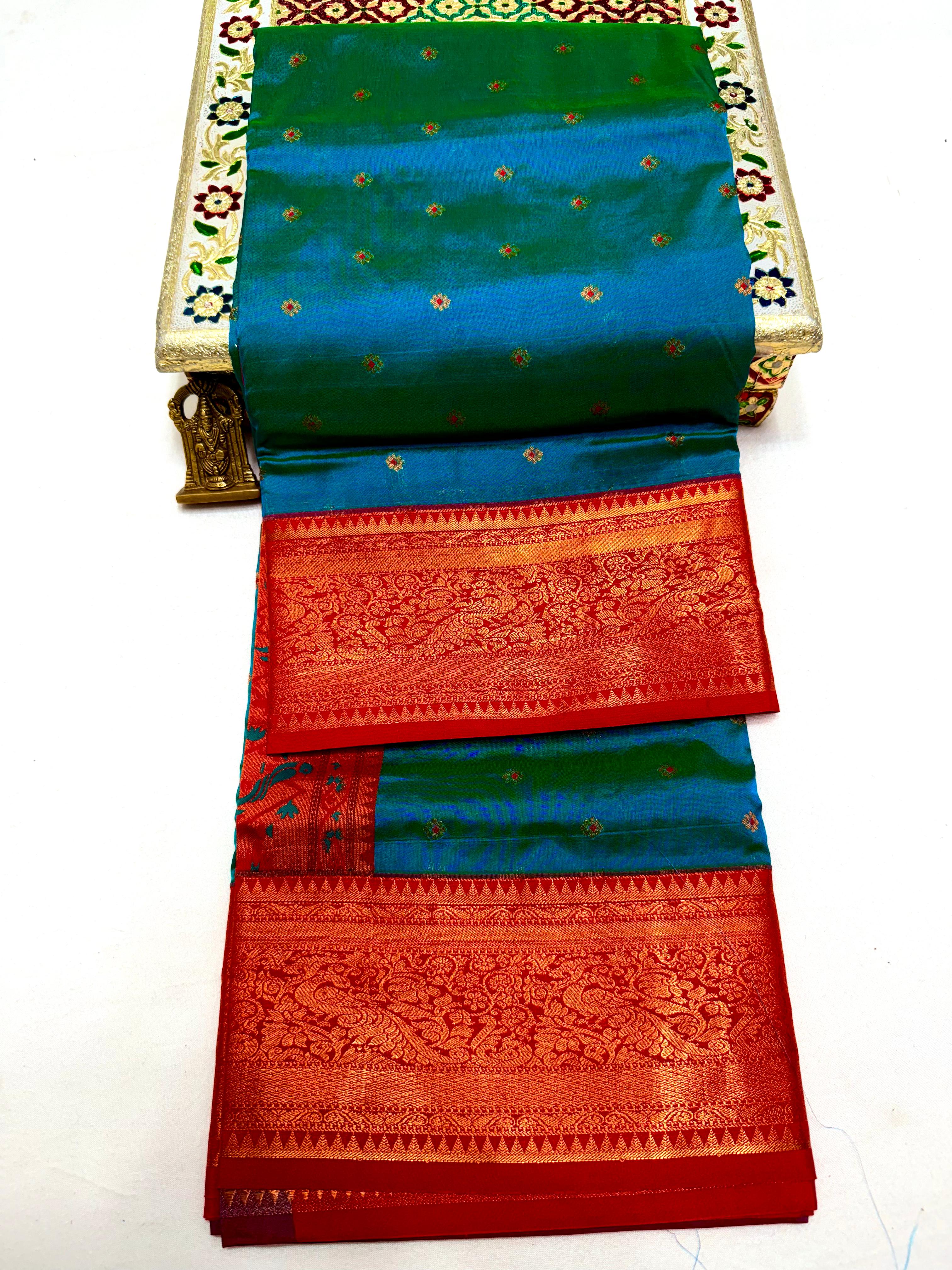 Make a grand statement this wedding season with our exclusive Dhanashree Kanjivaram Paithani Saree, crafted in rich silk with traditional detailing.