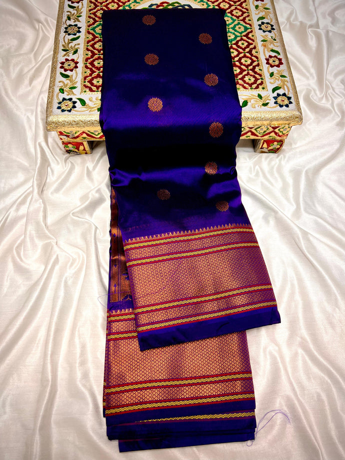 Traditional Kalanjali Paithani, Maharani Pallu with running Blouse.  This traditional Yeola Kalanjali Paithani features a rich Maharani Pallu and intricate all over buttis. Made with premium shiny Tana Softy Silk and 100% premium Zari, it offers a luxurious look and feel. The running blouse piece allows for a customized fit. Elevate your wardrobe with this premium paithani saree. Traditional Yeola Kalanjali Paithani