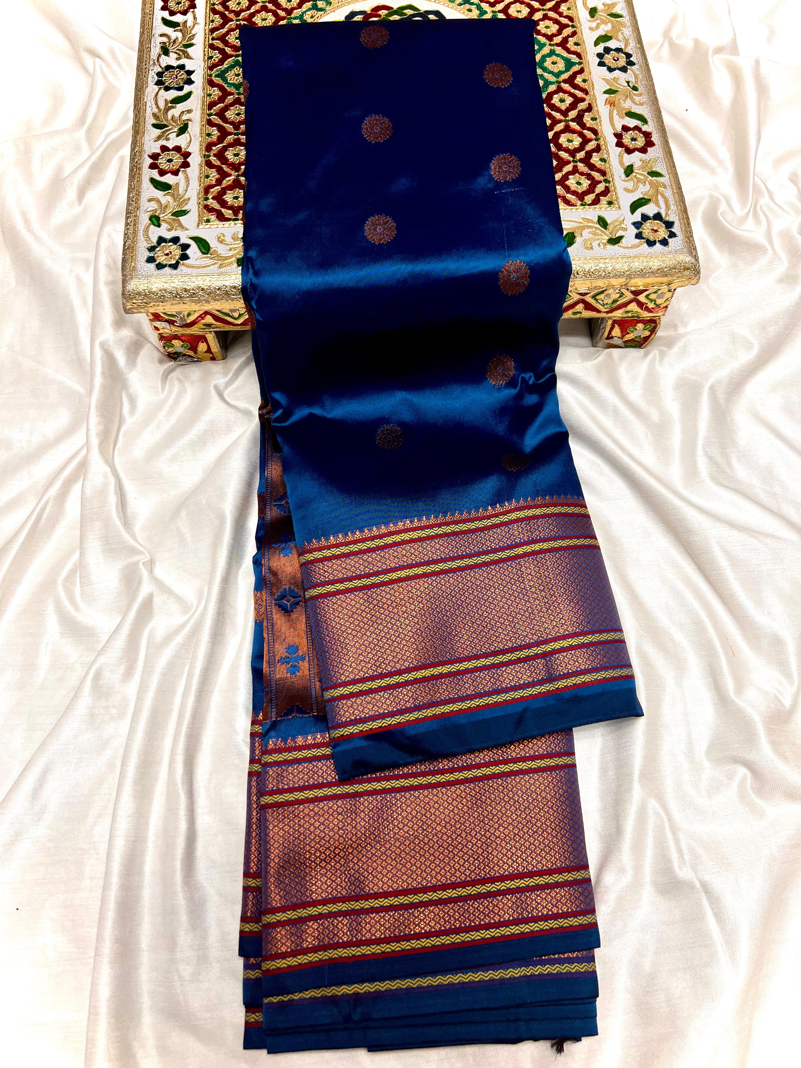 Traditional Kalanjali Paithani, Maharani Pallu with running Blouse. &nbsp;This traditional Yeola Kalanjali Paithani features a rich Maharani Pallu and intricate all over buttis. Made with premium shiny Tana Softy Silk and 100% premium Zari, it offers a luxurious look and feel. The running blouse piece allows for a customized fit. Elevate your wardrobe with this premium paithani saree.&nbsp;Traditional Yeola Kalanjali Paithani
