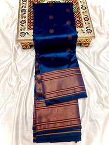 Traditional Kalanjali Paithani, Maharani Pallu with running Blouse. &nbsp;This traditional Yeola Kalanjali Paithani features a rich Maharani Pallu and intricate all over buttis. Made with premium shiny Tana Softy Silk and 100% premium Zari, it offers a luxurious look and feel. The running blouse piece allows for a customized fit. Elevate your wardrobe with this premium paithani saree.&nbsp;Traditional Yeola Kalanjali Paithani