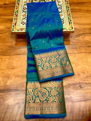 Kanjivaram Premier Tana Soft Silk Piathani Zari Butti with running Blouse.

Saree: Kanjivaram Paithani
Colors: Maroon, Blue, Navy Blue, Dark Green, Green, Red, Turqoise

Butti: All over Zari Butti

Pallu: Rich Pallu

Blouse: Running Blouse Piece

Fabrics: Premium Tana Soft Silk


This gorgeous Kanjivaram silk saree blends traditional design with modern elegance. Made from the finest Tana soft silk, it features intricate Piathani zari butti work and comes with a running blouse piece. With a luxurious feel an