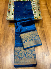 Load image into Gallery viewer, Kanjivaram Premier Tana Soft Silk Piathani Zari Butti with running Blouse.

Saree: Kanjivaram Paithani
Colors: Maroon, Blue, Navy Blue, Dark Green, Green, Red, Turqoise

Butti: All over Zari Butti

Pallu: Rich Pallu

Blouse: Running Blouse Piece

Fabrics: Premium Tana Soft Silk


This gorgeous Kanjivaram silk saree blends traditional design with modern elegance. Made from the finest Tana soft silk, it features intricate Piathani zari butti work and comes with a running blouse piece. With a luxurious feel an