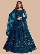 Load image into Gallery viewer, Stylish Teal Net Embroidered Lehenga Choli with Dupatta Set For Women

Color: Teal
Fabric: Net
Type: Semi Stitched
Style: Embroidered
Waist: 28.0 - 38.0 (in inches)
Bust: 38.0 - 44.0 (in inches)
Net Embroidered Lehenga Choli with Dupatta Set For Women, Dupatta Length- 2.0 Mtr

This stylish teal net embroidered lehenga choli with dupatta set for women combines traditional design with a contemporary touch. Made from high-quality net fabric, the intricate embroidery adds a touch of elegance to the ensemble. Pe