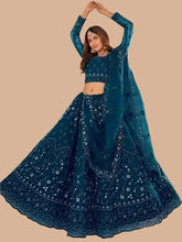 Load image into Gallery viewer, Stylish Teal Net Embroidered Lehenga Choli with Dupatta Set For Women

Color: Teal
Fabric: Net
Type: Semi Stitched
Style: Embroidered
Waist: 28.0 - 38.0 (in inches)
Bust: 38.0 - 44.0 (in inches)
Net Embroidered Lehenga Choli with Dupatta Set For Women, Dupatta Length- 2.0 Mtr

This stylish teal net embroidered lehenga choli with dupatta set for women combines traditional design with a contemporary touch. Made from high-quality net fabric, the intricate embroidery adds a touch of elegance to the ensemble. Pe