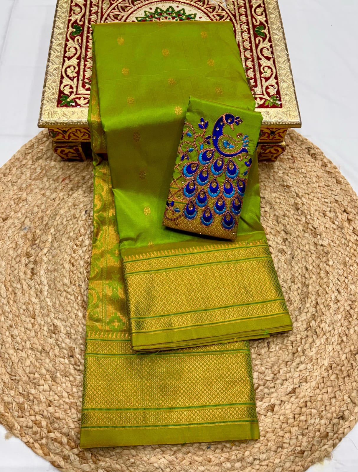 Elevate your festive and wedding wardrobe with the Trisha Kalanjali Paithani Saree, featuring elegant all-over butti weaving, a rich traditional pallu, and a beautifully detailed blouse with Aari work and Diamond Swarovski-style embellishments. Crafted from premium Tana soft silk for a graceful and comfortable drape.