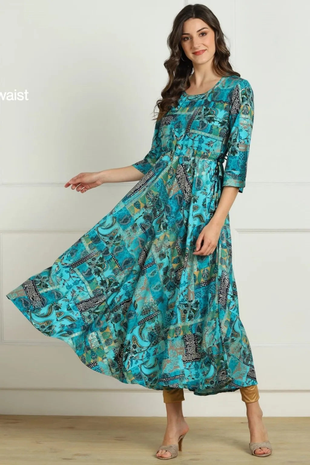 Shop elegant blue multi ethnic print long kurti in premium rayon slub with flared hem and dori bead detailing. Stylish and comfortable ethnic wear available in M and XXL.