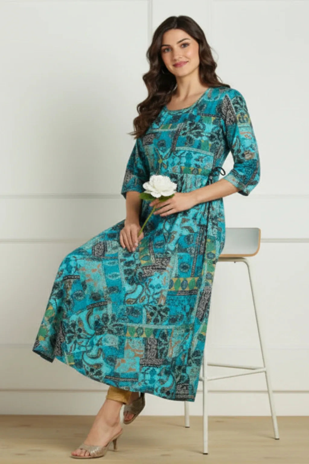 Shop elegant blue multi ethnic print long kurti in premium rayon slub with flared hem and dori bead detailing. Stylish and comfortable ethnic wear available in M and XXL.