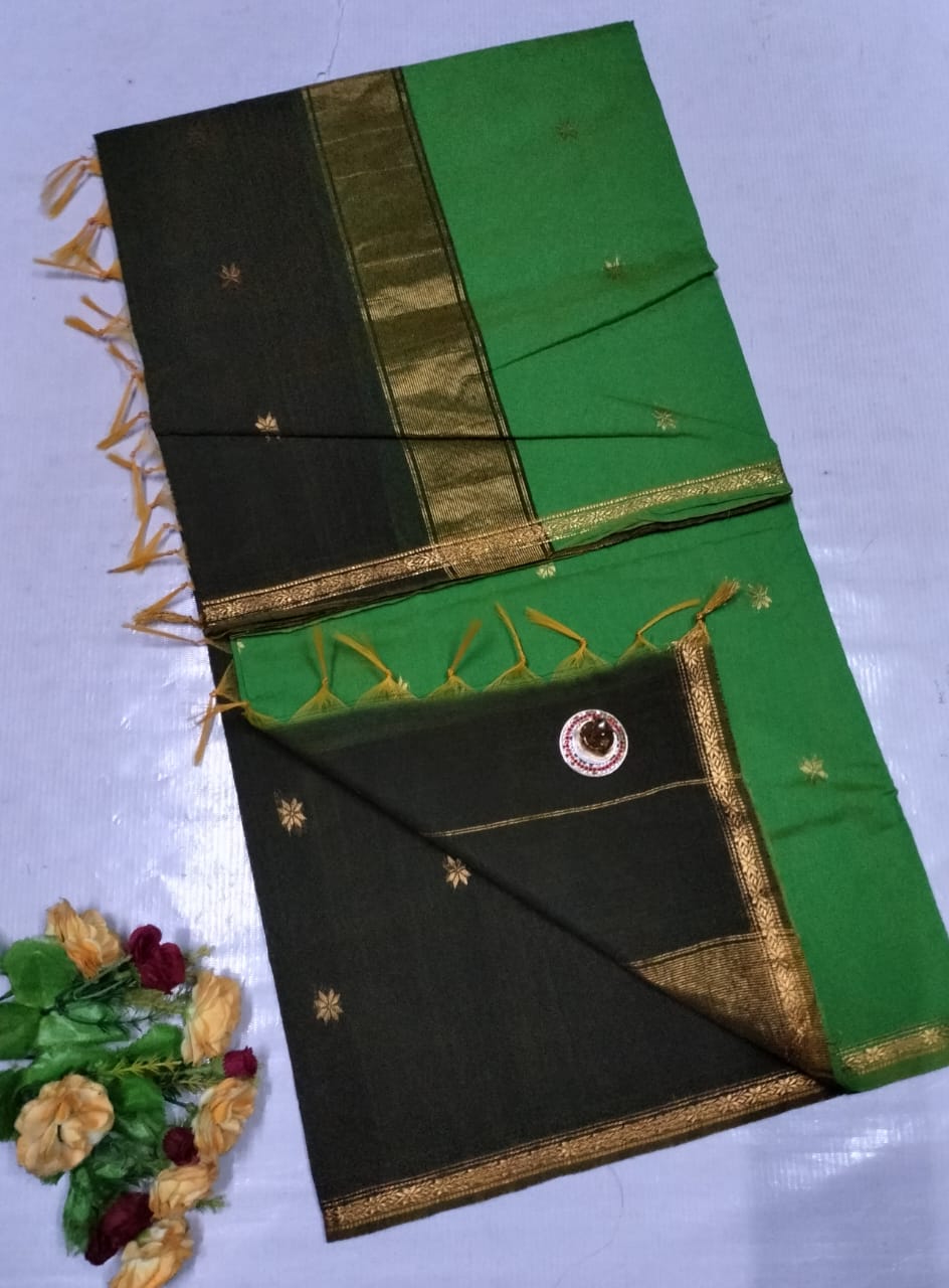 Green and black saree with gold border on a light blue background Premium Maheshwari Silk Cotton Sarees Gadwal-Inspired | Sleek Dual Borders | Contrast Pallu & Blouse.