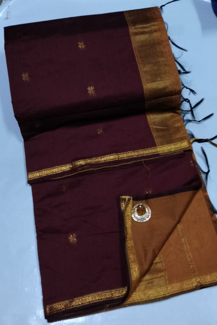 Maroon saree with gold border and patterns on a white background. Premium Maheshwari Silk Cotton Sarees Gadwal-Inspired | Sleek Dual Borders | Contrast Pallu & Blouse.