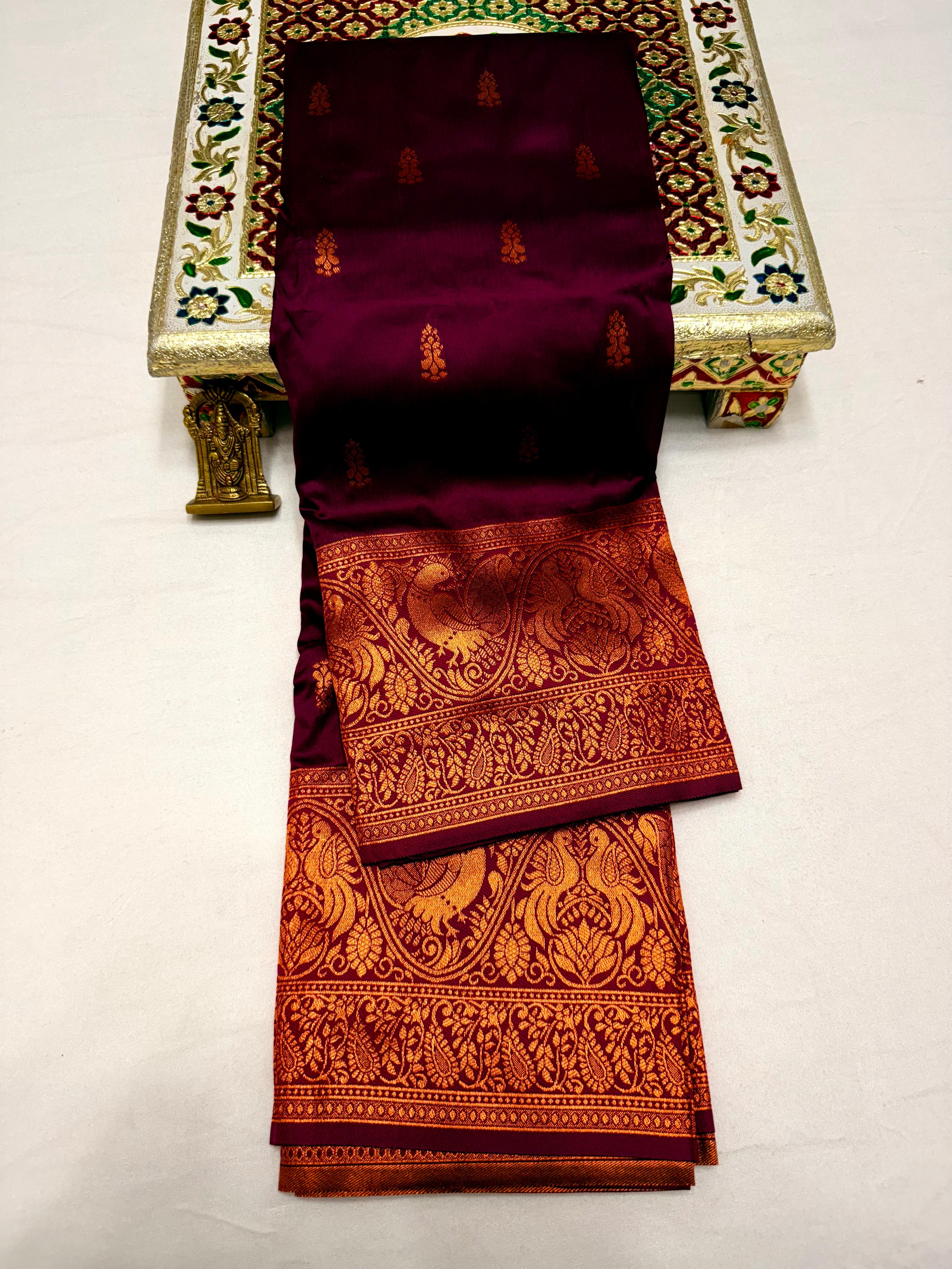 Elevate your ethnic wardrobe with this Mahalaxmi Kanjivaram Paithani Saree, crafted from Pure Soft Silk with rich all-over buttis, a grand pallu, and matching running blouse piece — perfect for festivals and weddings.