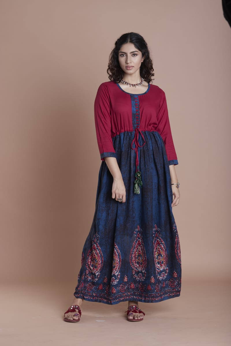 Georgeous Gold Anarkali in Dark Navy Blue with maroon Top.This Dark Navy Blue Anarkali dress features a stunning gold design and a maroon top, adding a pop of color. Made from high-quality materials, it offers both comfort and style. Perfect for any special occasion, this dress will make you stand out with its elegant and unique design.