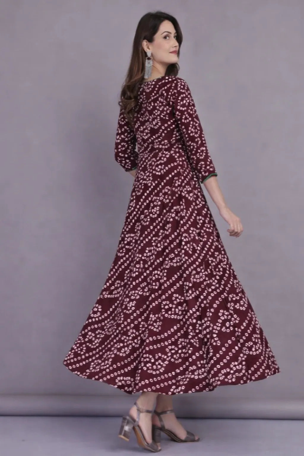 Shop stylish maroon cotton Bandhej printed flared long kurti for women. Elegant ethnic design with comfortable fabric, available in M, L, XL. Perfect for festive and casual wear.