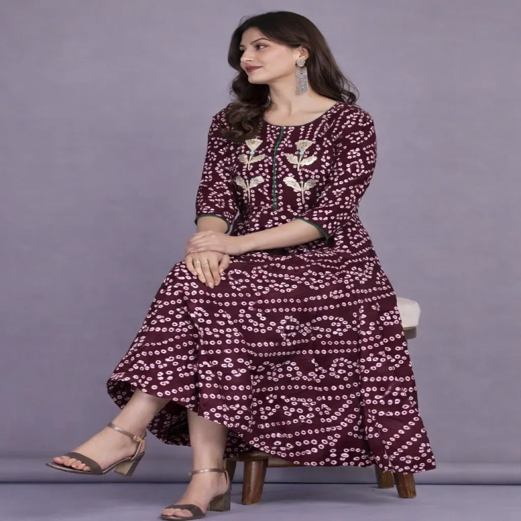 Shop stylish maroon cotton Bandhej printed flared long kurti for women. Elegant ethnic design with comfortable fabric, available in M, L, XL. Perfect for festive and casual wear.