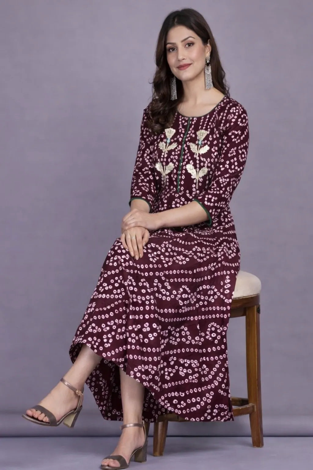 Shop stylish maroon cotton Bandhej printed flared long kurti for women. Elegant ethnic design with comfortable fabric, available in M, L, XL. Perfect for festive and casual wear.
